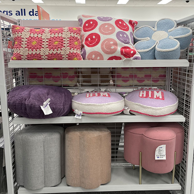 Decorative pillows and poofs from a Ross store.